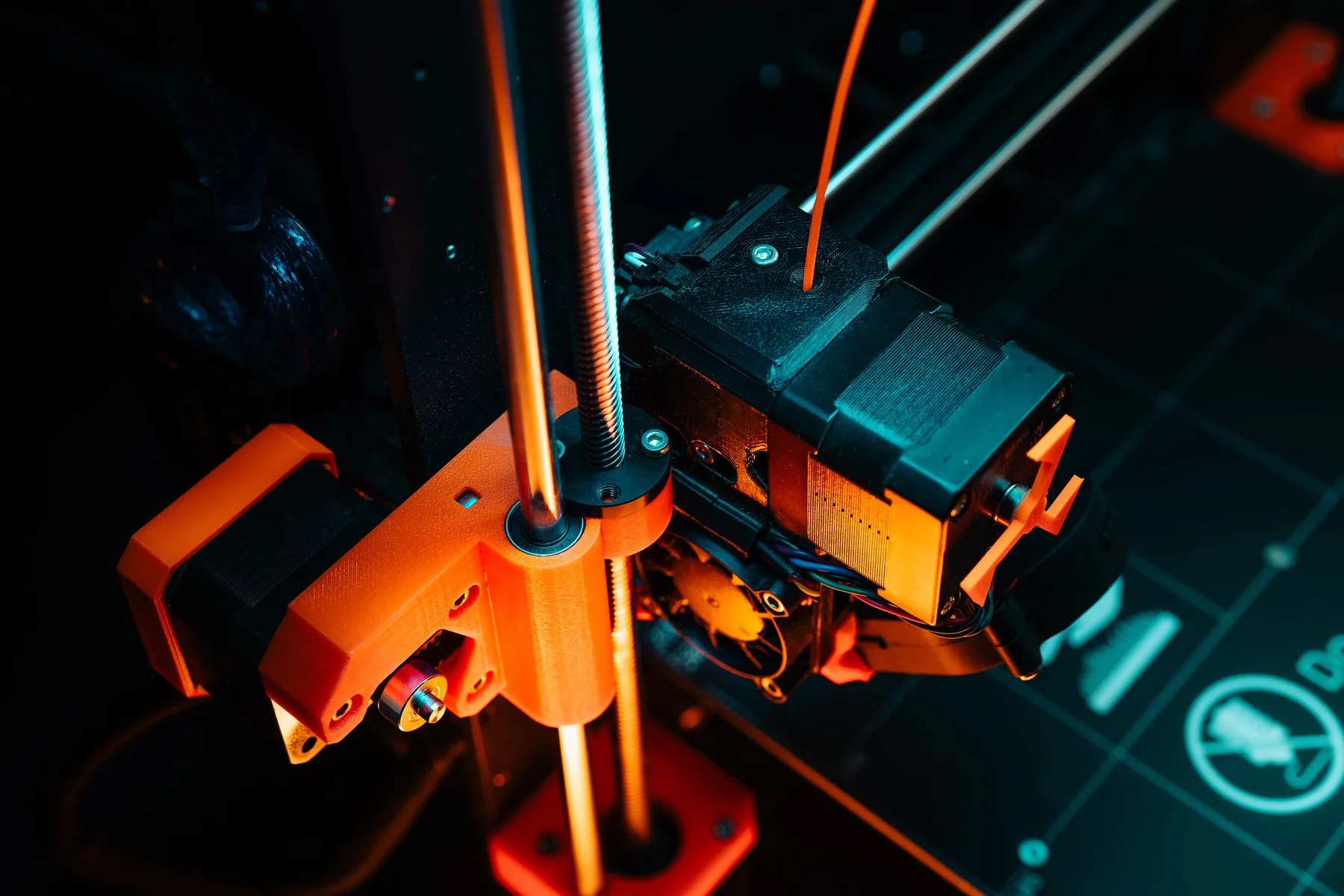 Close view of a 3D printer building a colourful form