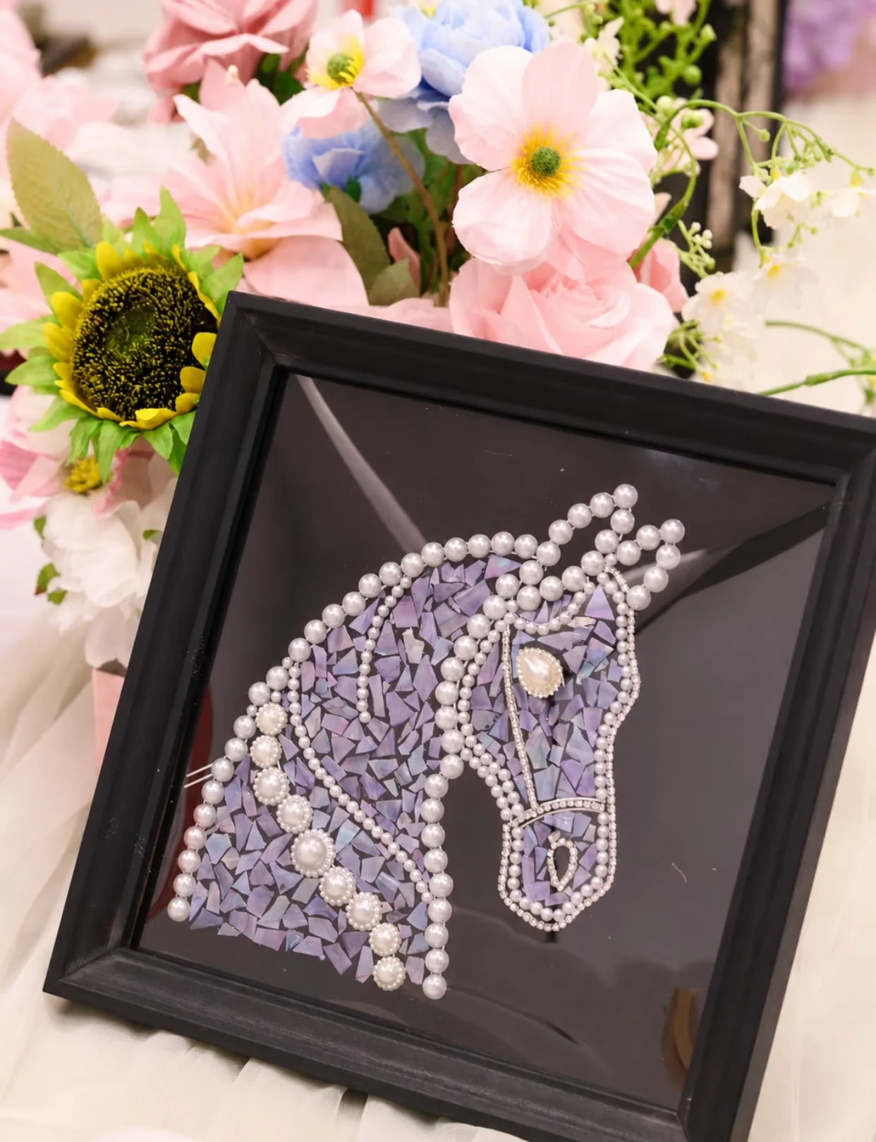 Framed pearl and purple mosaic collage with an abstract fashion form